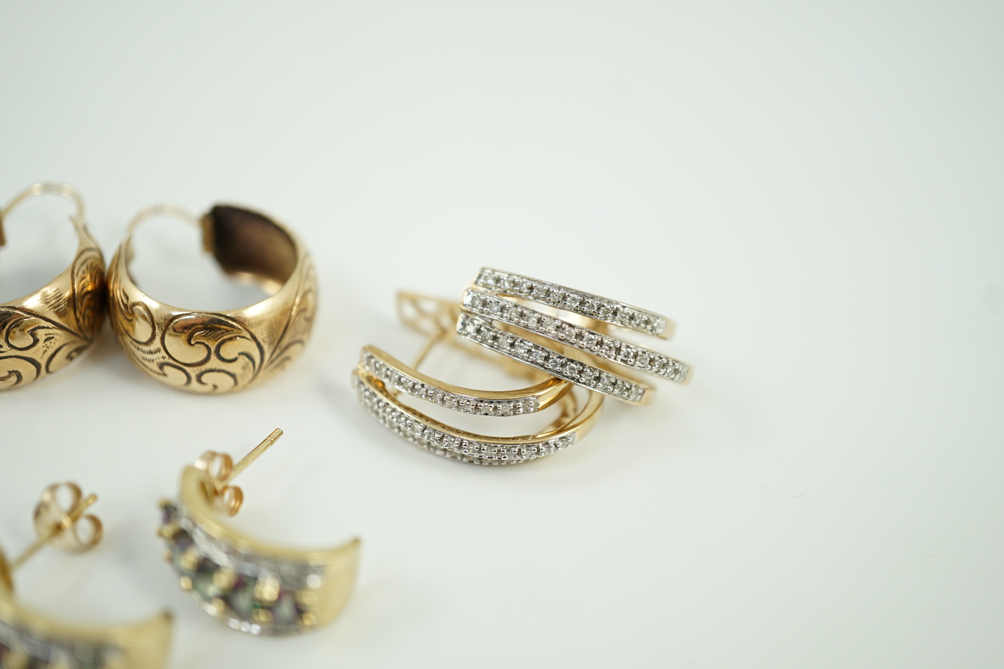 Four assorted modern pairs of 9ct gold and gem set earrings and one pair of yellow metal earrings, gross weight, 23.2 grams.